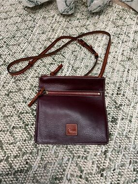 Dooney & Bourke Burgundy Leather Crossbody with adjustable Tan Strap